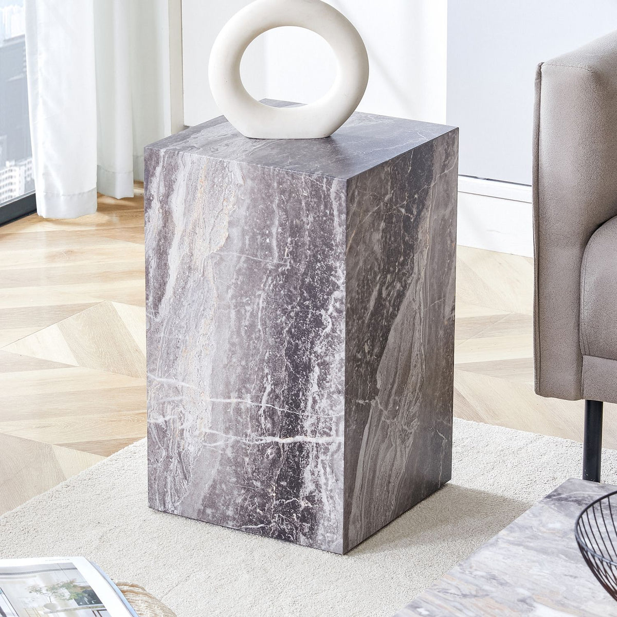 Elevate your living space with this modern MDF coffee table, which showcases gray textured patterns. It is characterized by stylish design.